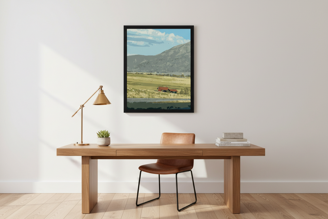 Wooden desk with chair in a room with a framed countryside landscape canvas print on the wall.