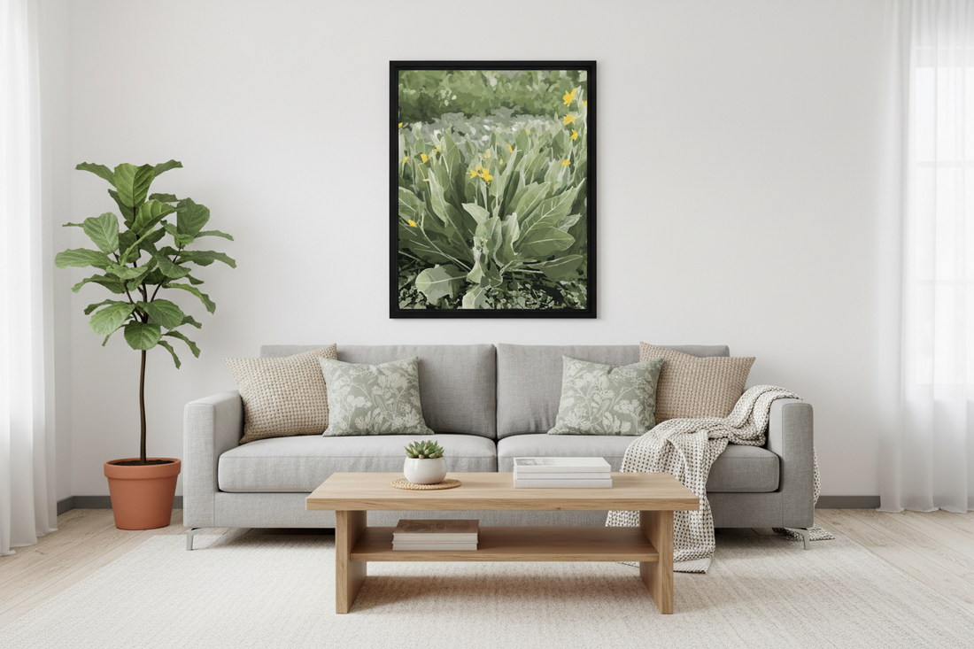 Living room with a gray sofa, wooden coffee table, and a framed wildflower print on the wall.