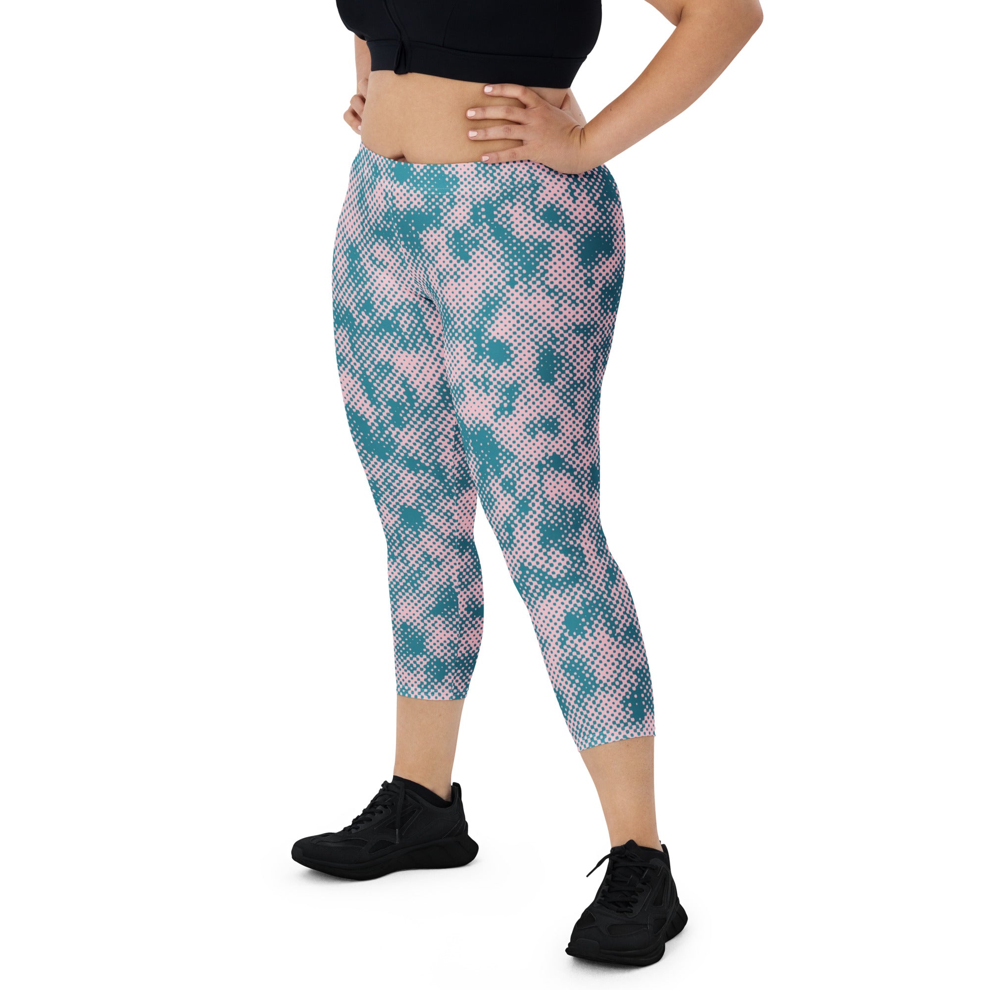 Model wearing abstract camo capris workout