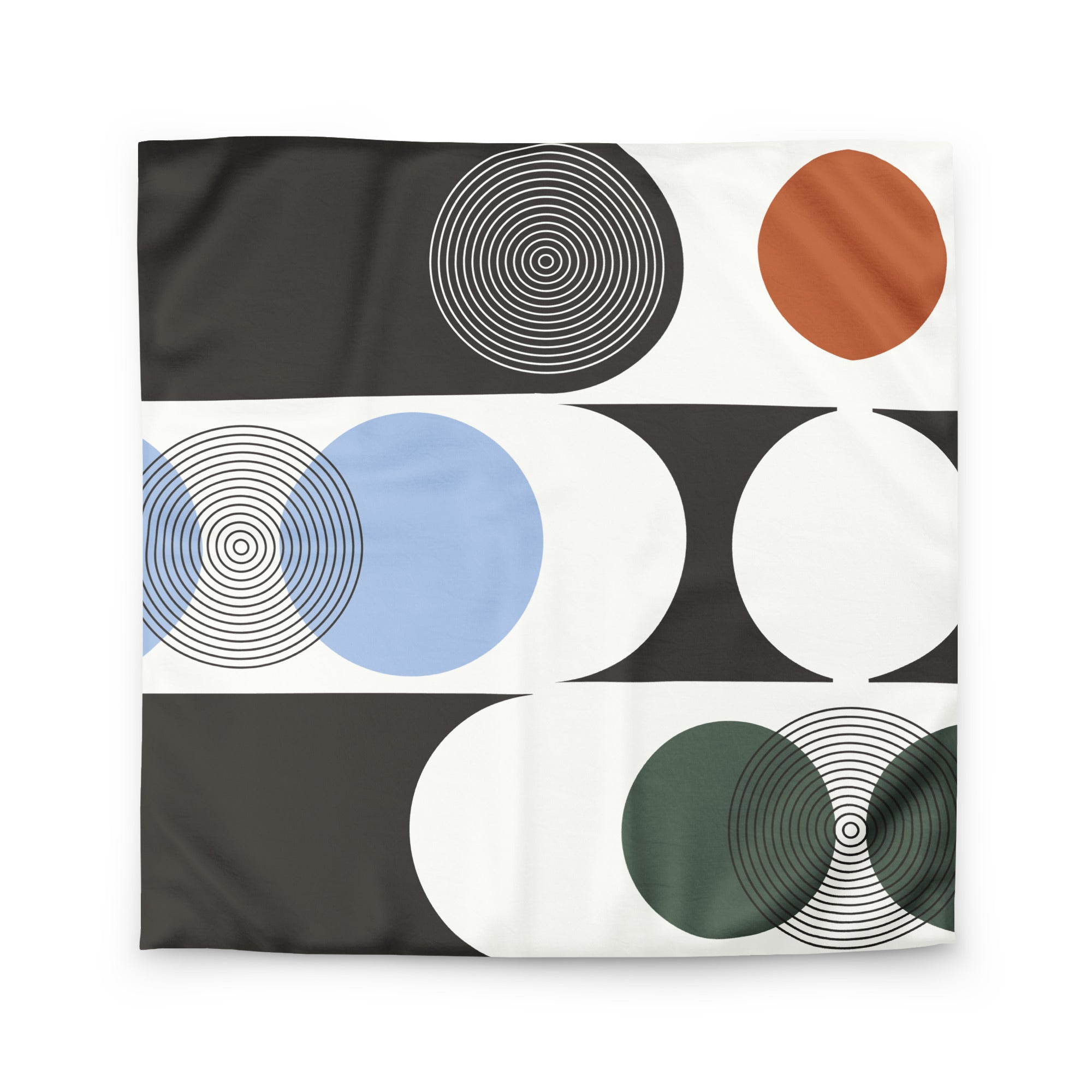 flat lay of modernist abstract bedspread featuring earthy geometric forms