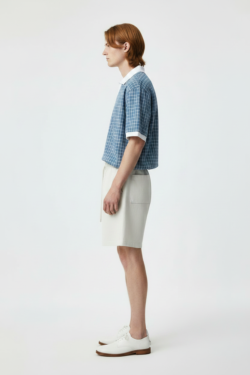 side view of male model in unisex boxy polo shirt 