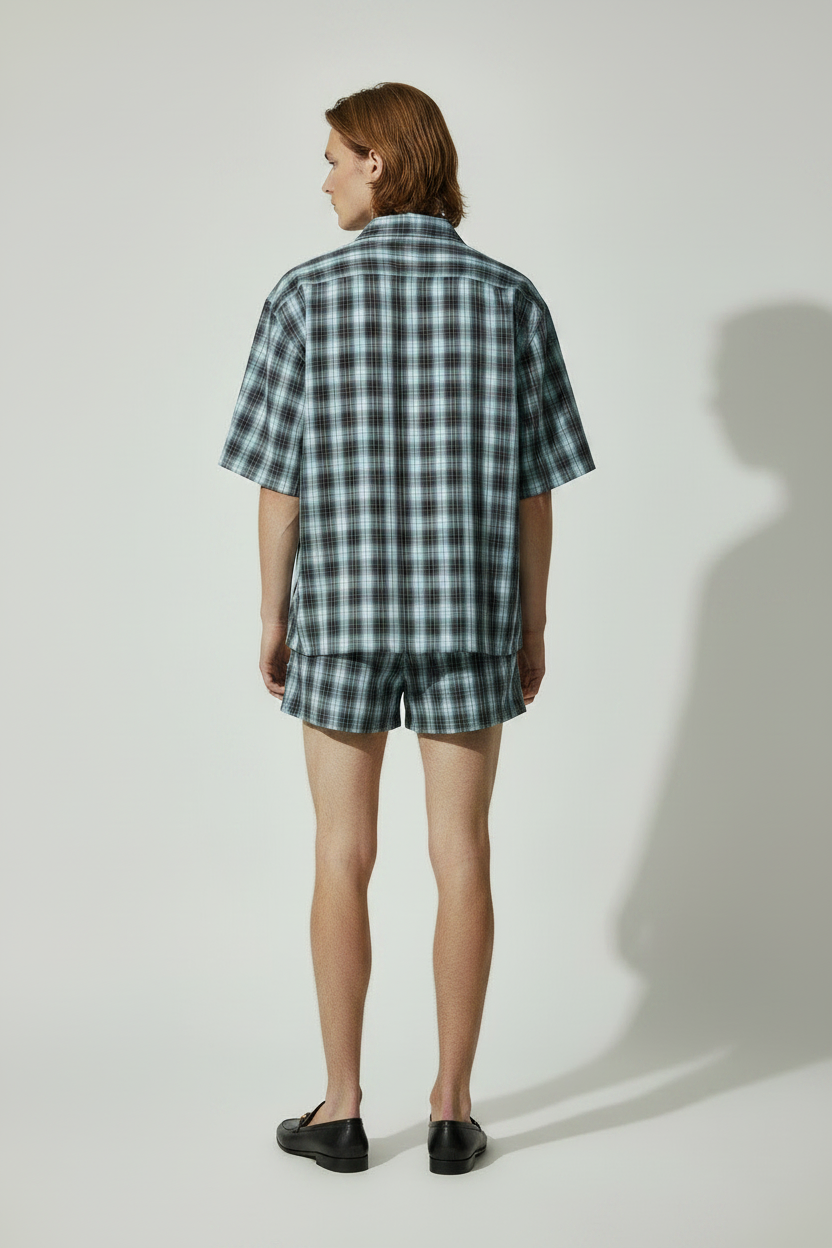 back view length detail of boxy plaid blue shirt and matching unisex plaid shorts 