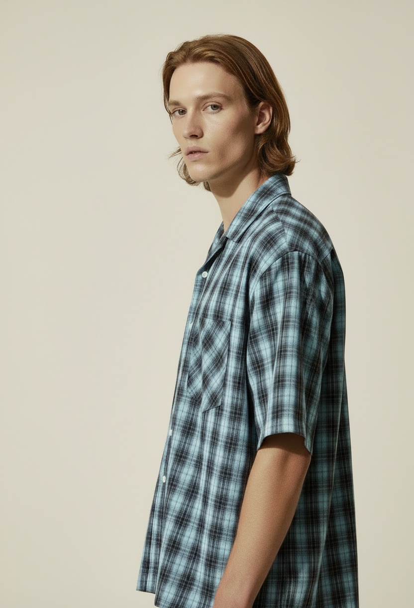 side view of short sleeve blue plaid shirt with lapel collar 