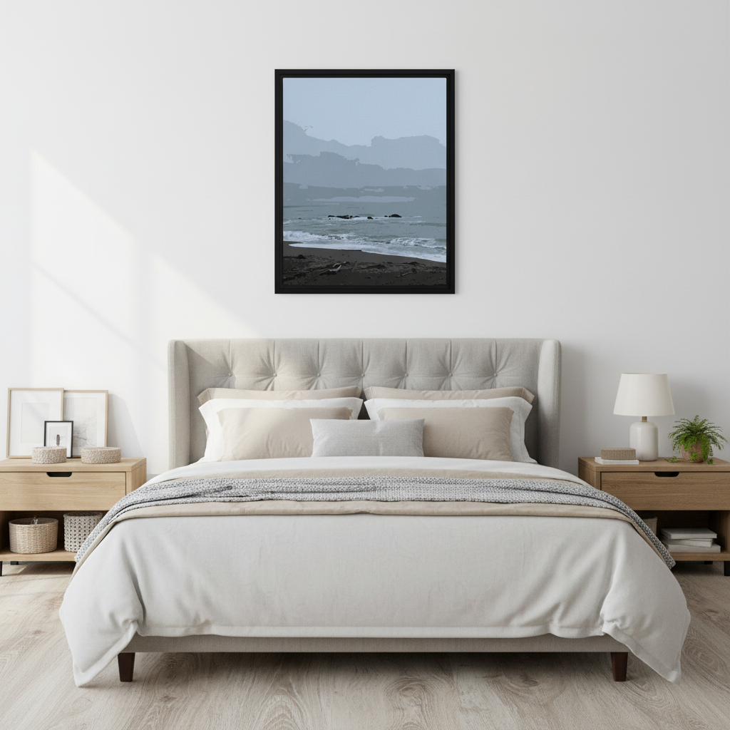 Bedroom with a bed, nightstands, and a framed picture of a coastal beach on the wall.