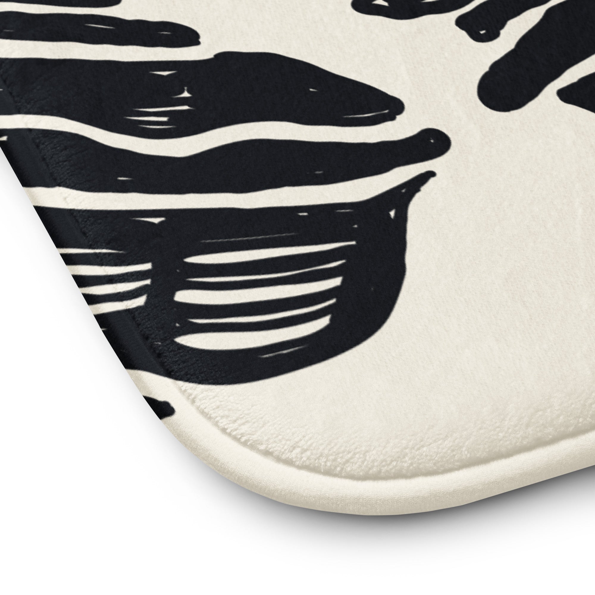 Close-up of coastal ocean-themed bath rug 