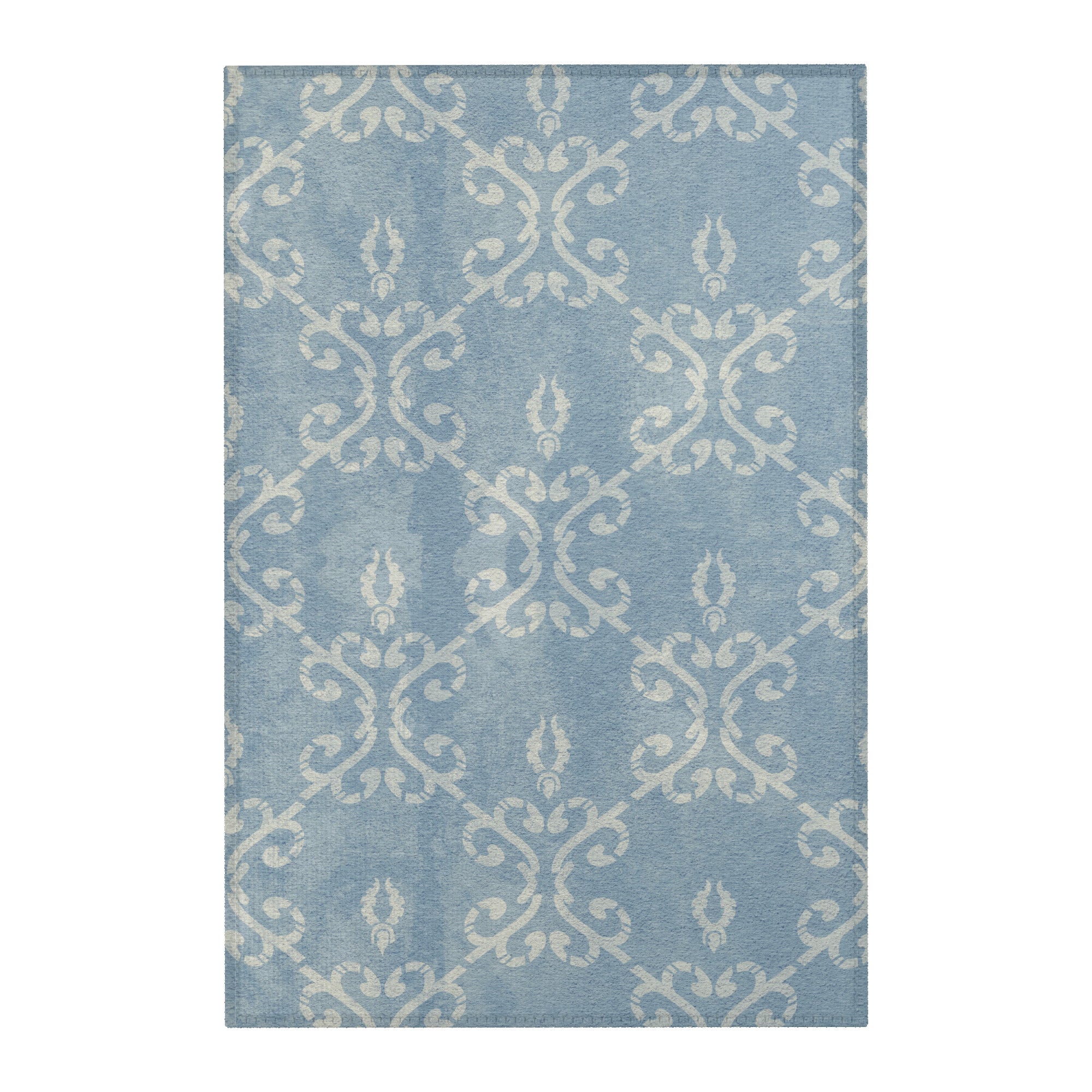 flat lay of vintage distressed dusty blue damask area rug 