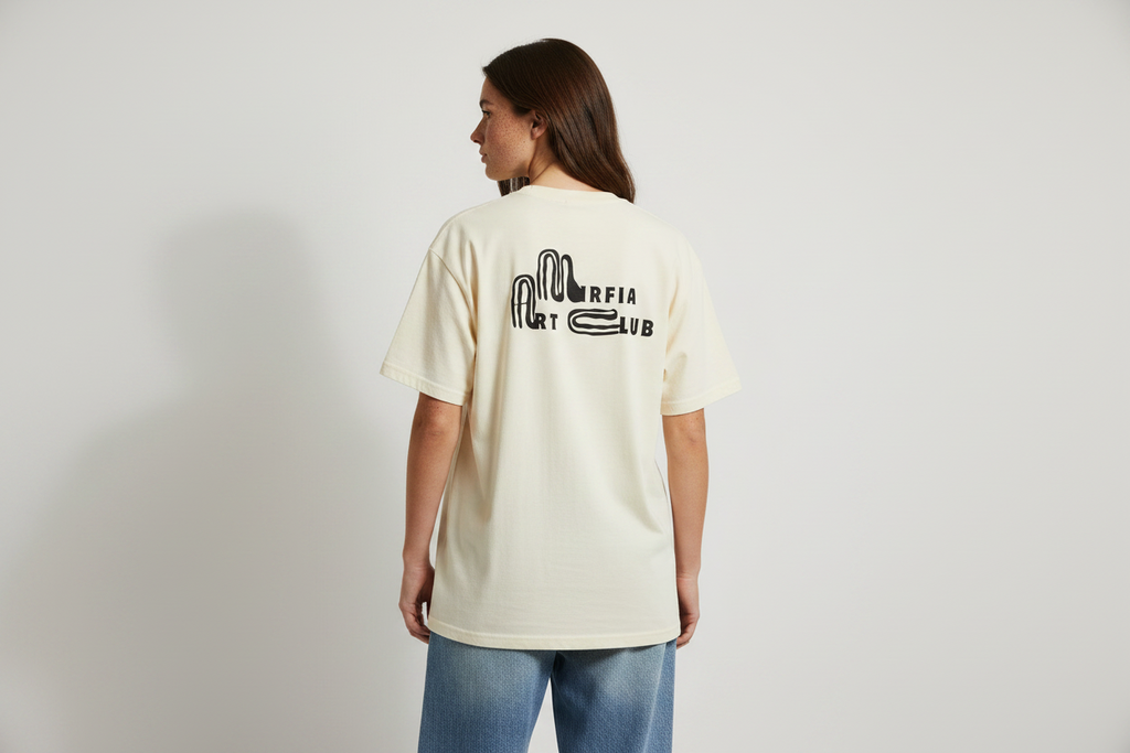 back view of faded oversized graphic t-shirt with text