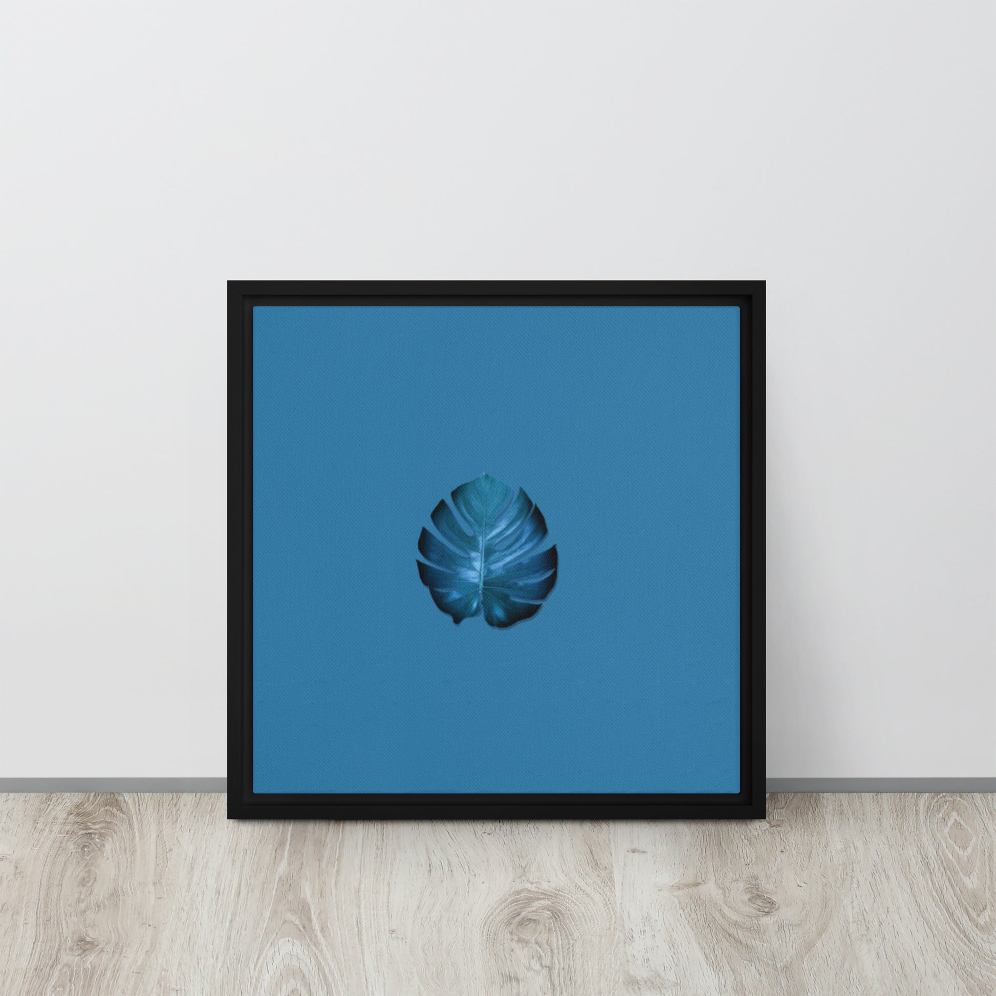 blue palm leaf canvas print wall art black floater frame 