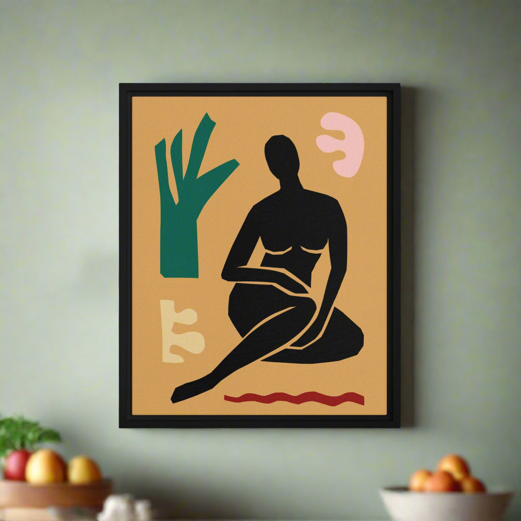 Framed abstract artwork with a black silhouette of a person, green tree, and pink abstract shapes on a gold background.