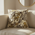 golden koi silk pillow with braided trim on couch