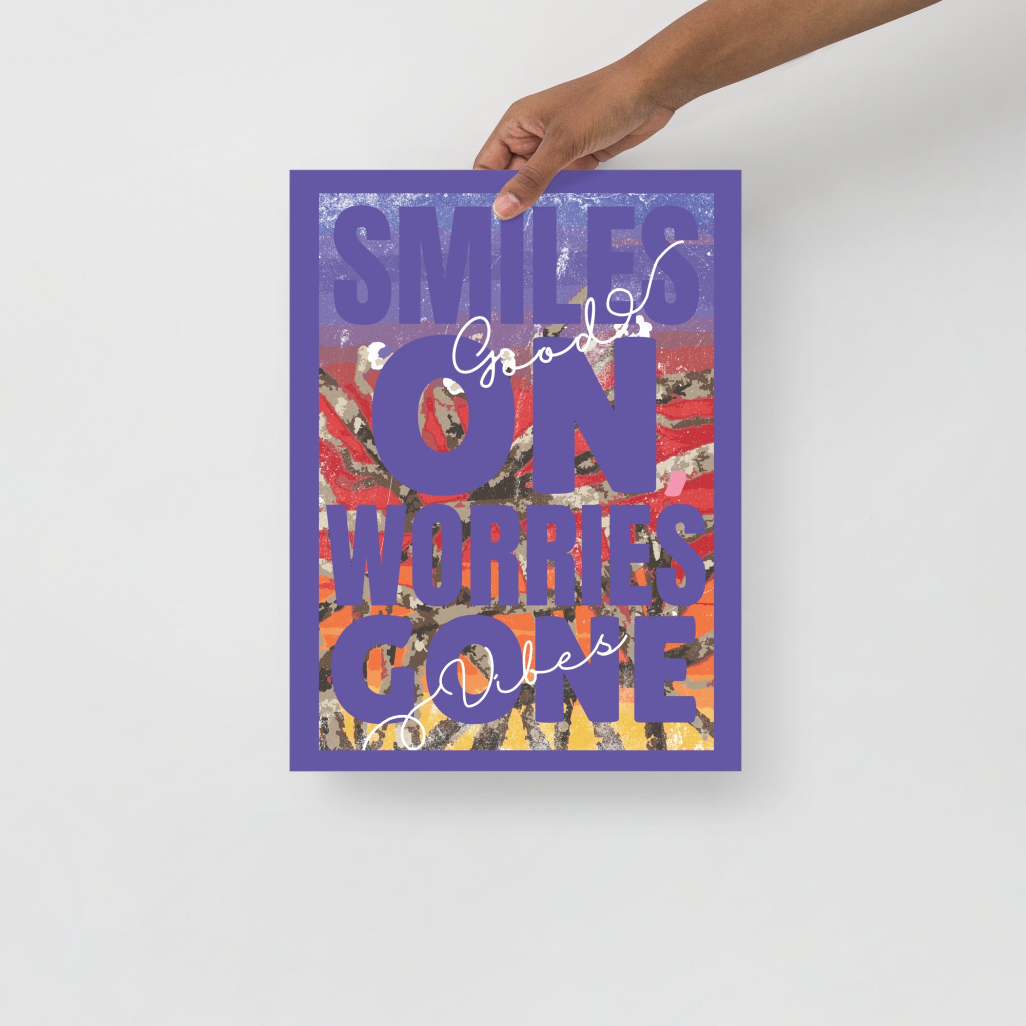 Hand holding an inspiraional abstract wall art print with text on a white background