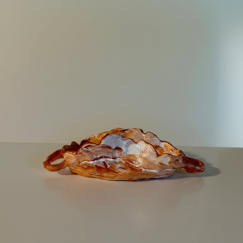 marbled decorative ceramic dish with two loop handles and organic shape