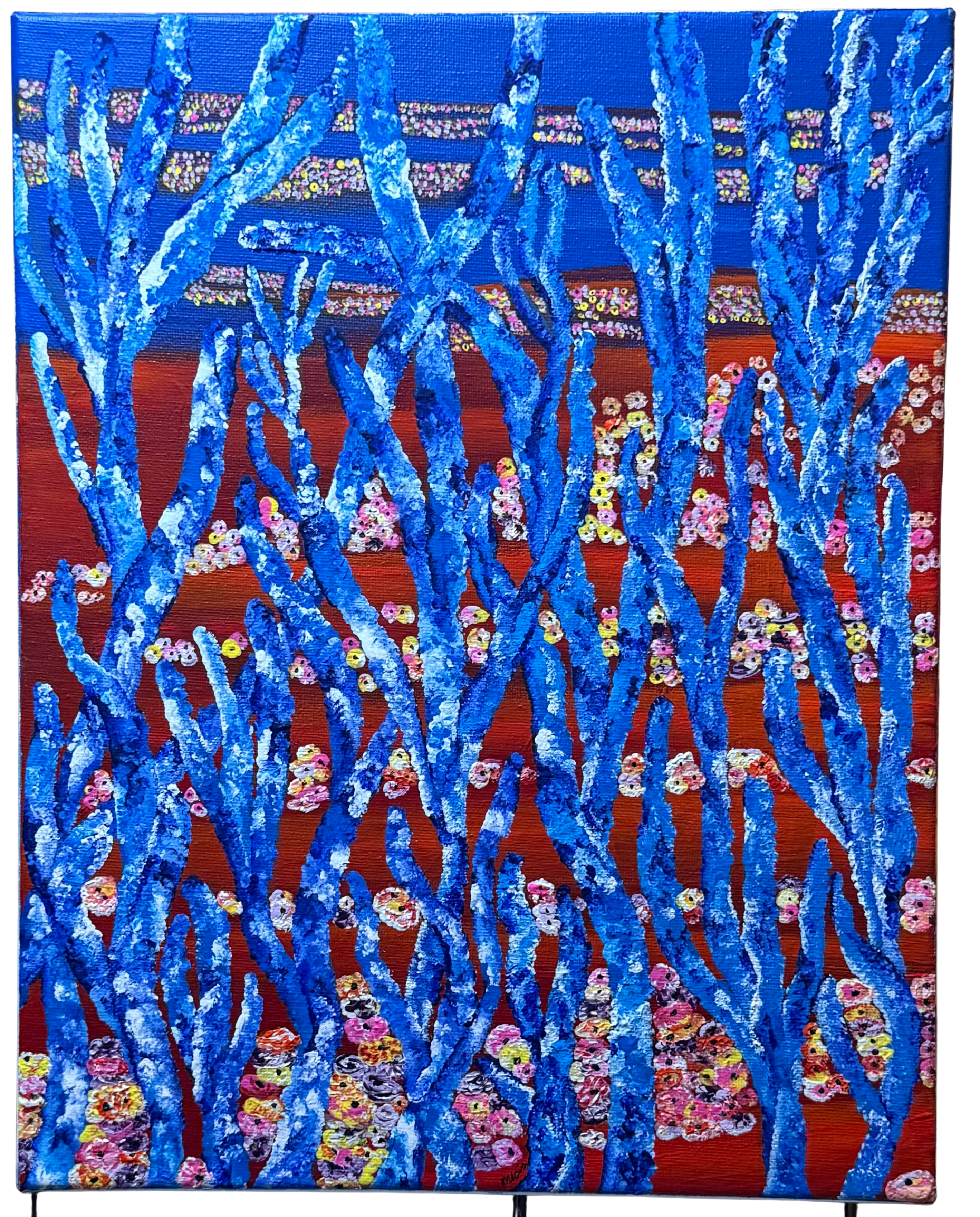 close up detail of layered acrylic texture in blue artwork