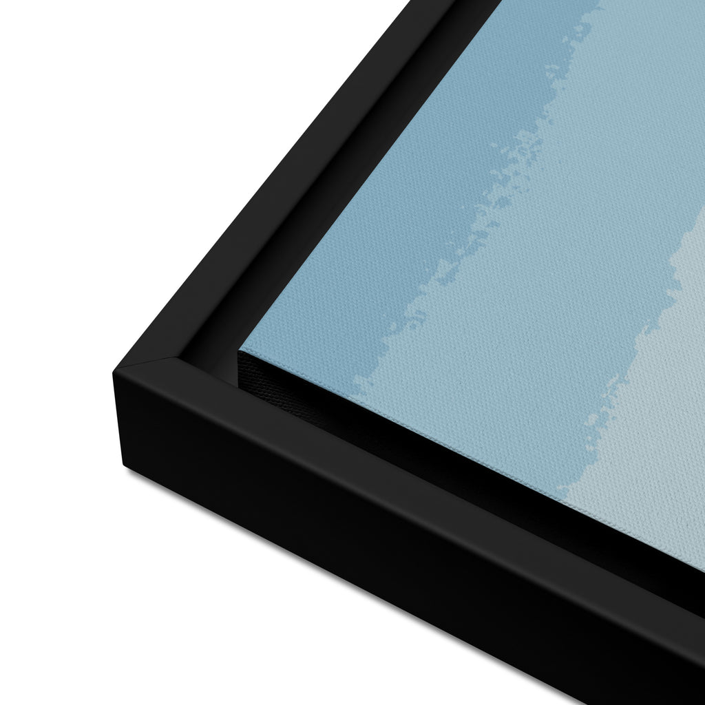 Close-up of a black framed canvas with a blue background