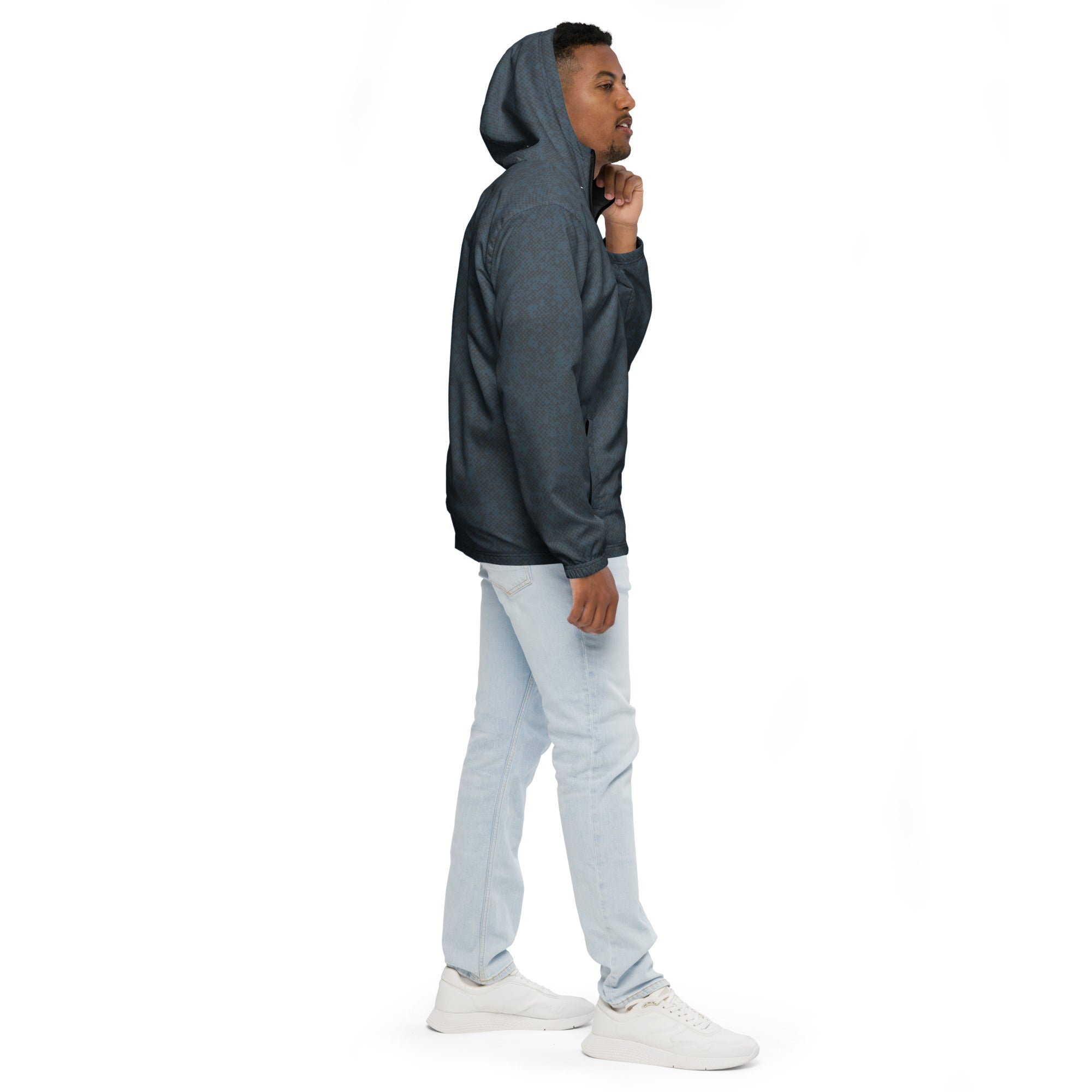 Person wearing a dark blue windbreaker jacket on a white background