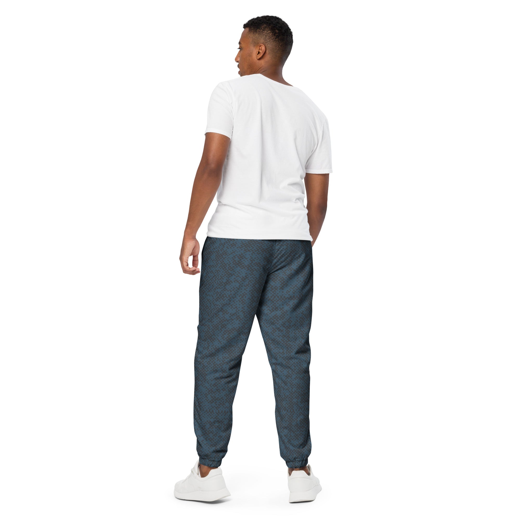 Back view of man wearing a white t-shirt and blue jogger pants on a white background