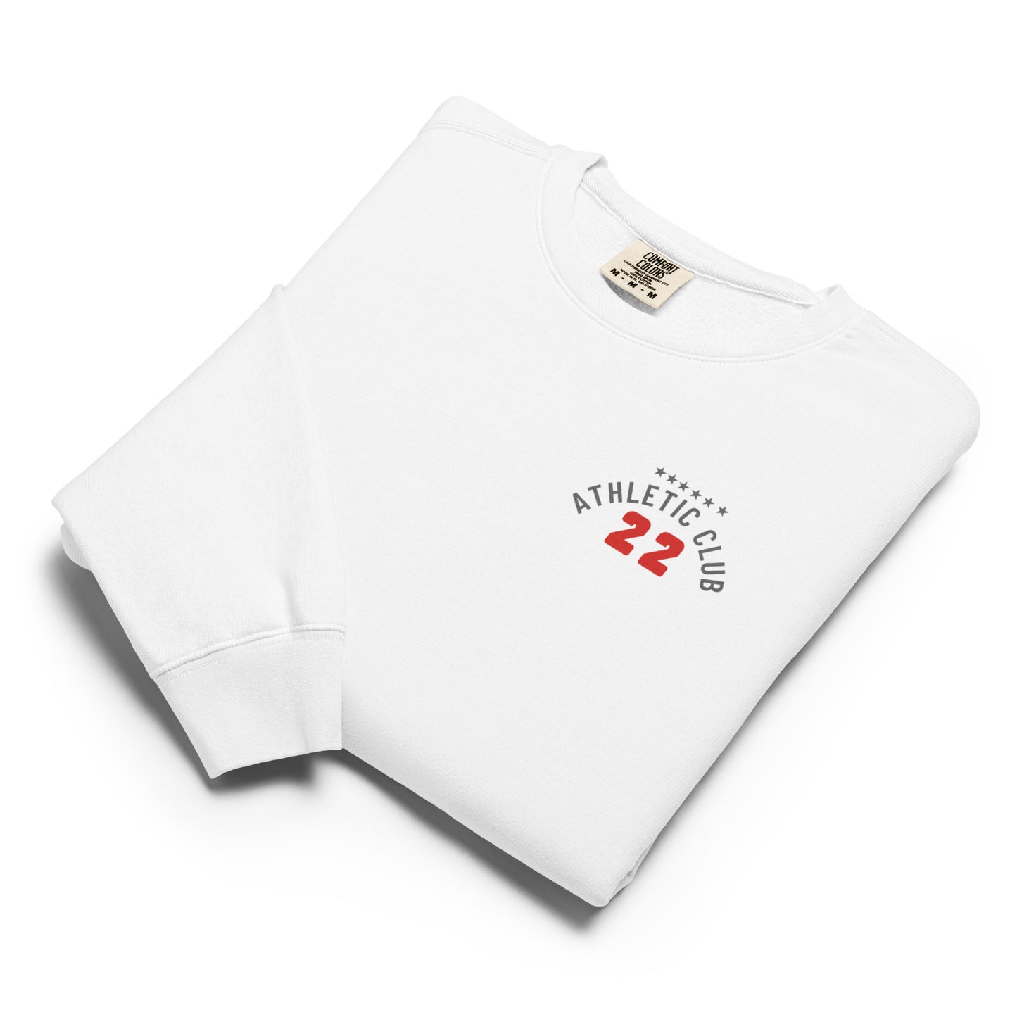 folded view of men's garment-dyed white fleece top