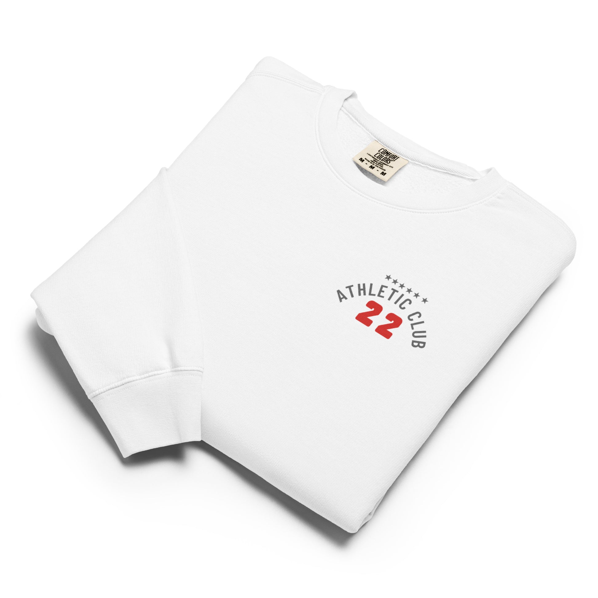 folded view of men's garment-dyed white fleece top