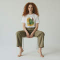 model sitting on a chair wearing a mixed media abstract painting graphic printed on organic cotton tee