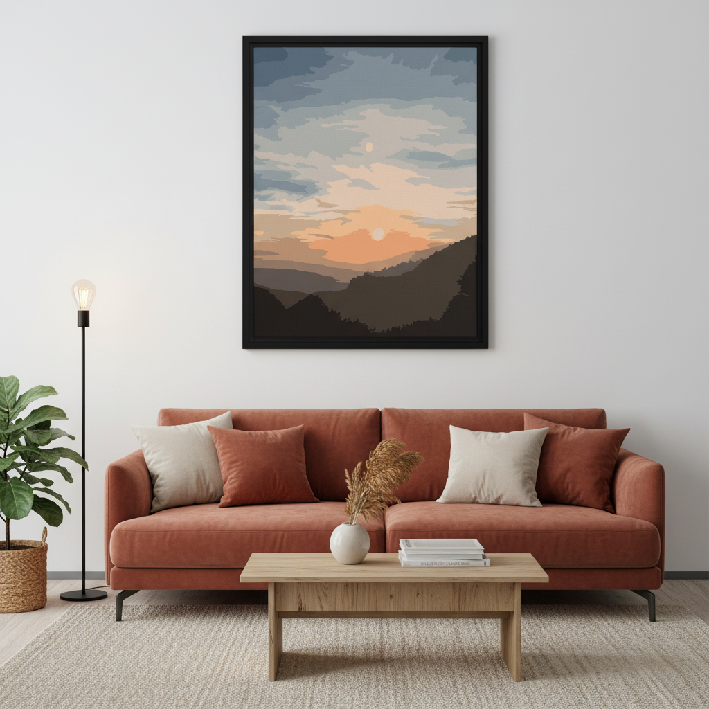 Living room with a red sofa, wooden coffee table, and framed mountain sunset landscape above the sofa.