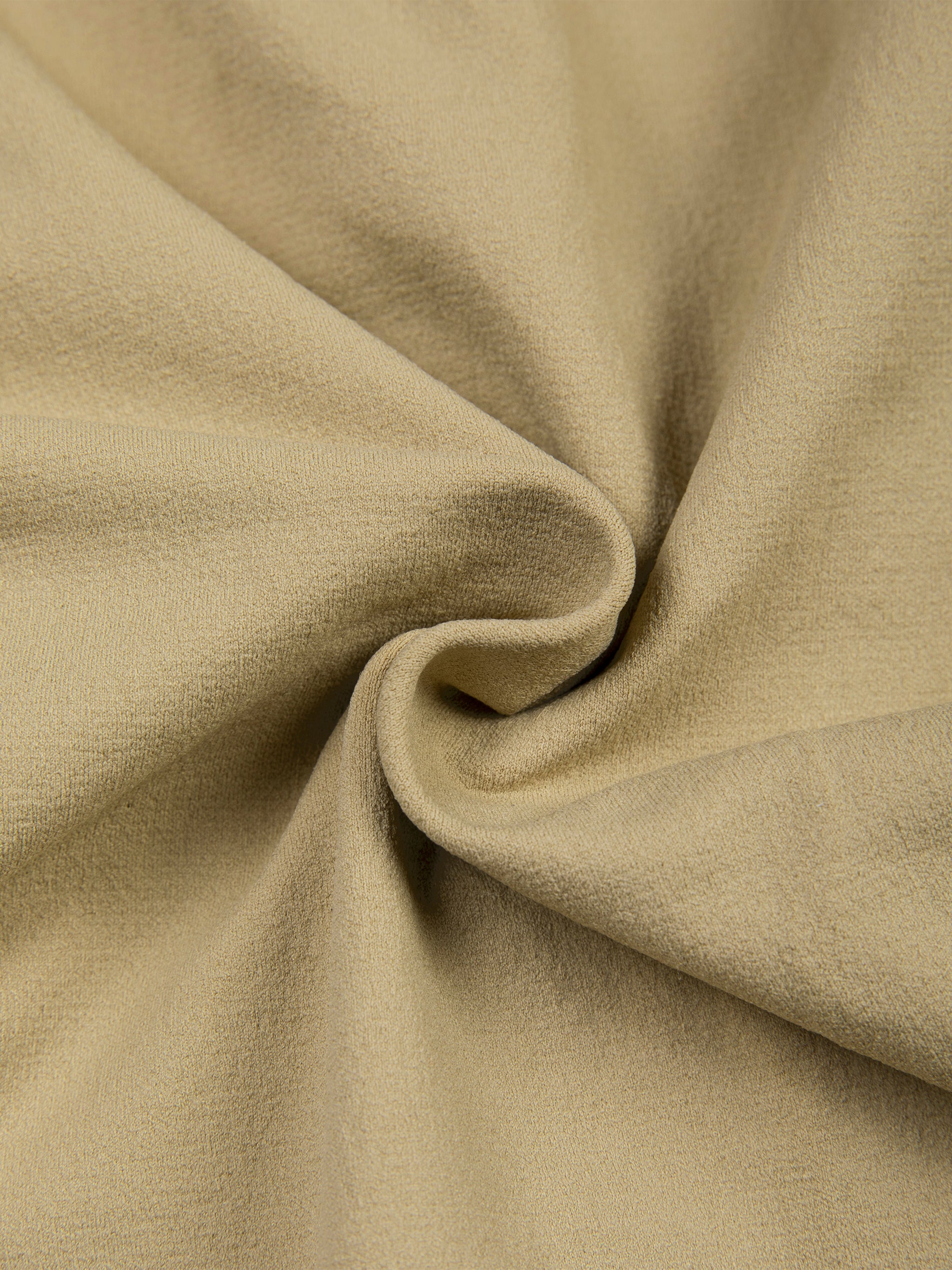 Close-up of beige ruched zip sporty bodysuit fabric detail with folds