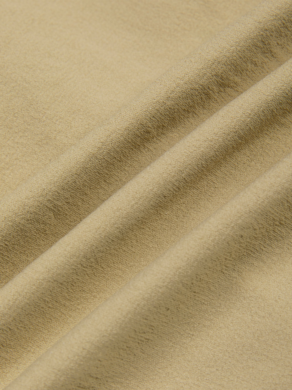 Close-up of beige ruched sporty bodysuit fabric with visible texture