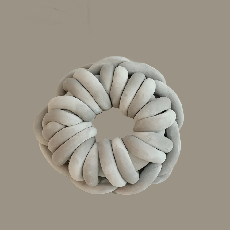 Grey knotted pillow round donut shaped weaved throw pillow