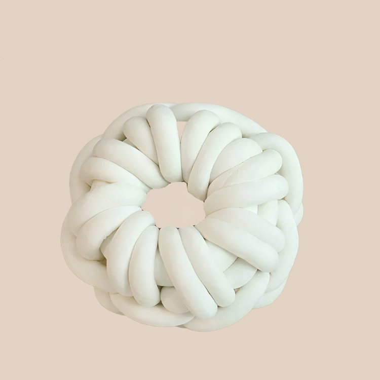 White knotted pillow round donut shaped weaved throw pillow