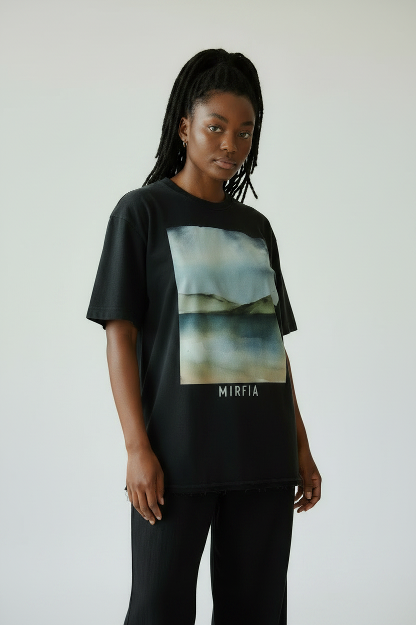 model wearing vintage washed frayed graphic t-shirt side view