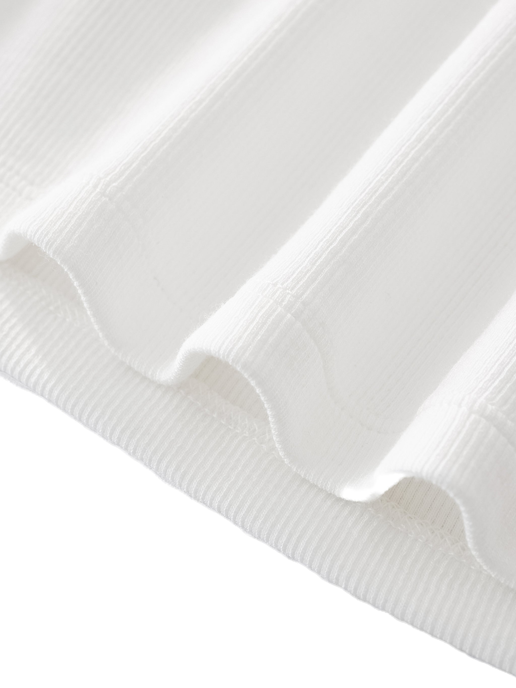 hemline detail of women's minimal wide neck baby t-shirt in white 