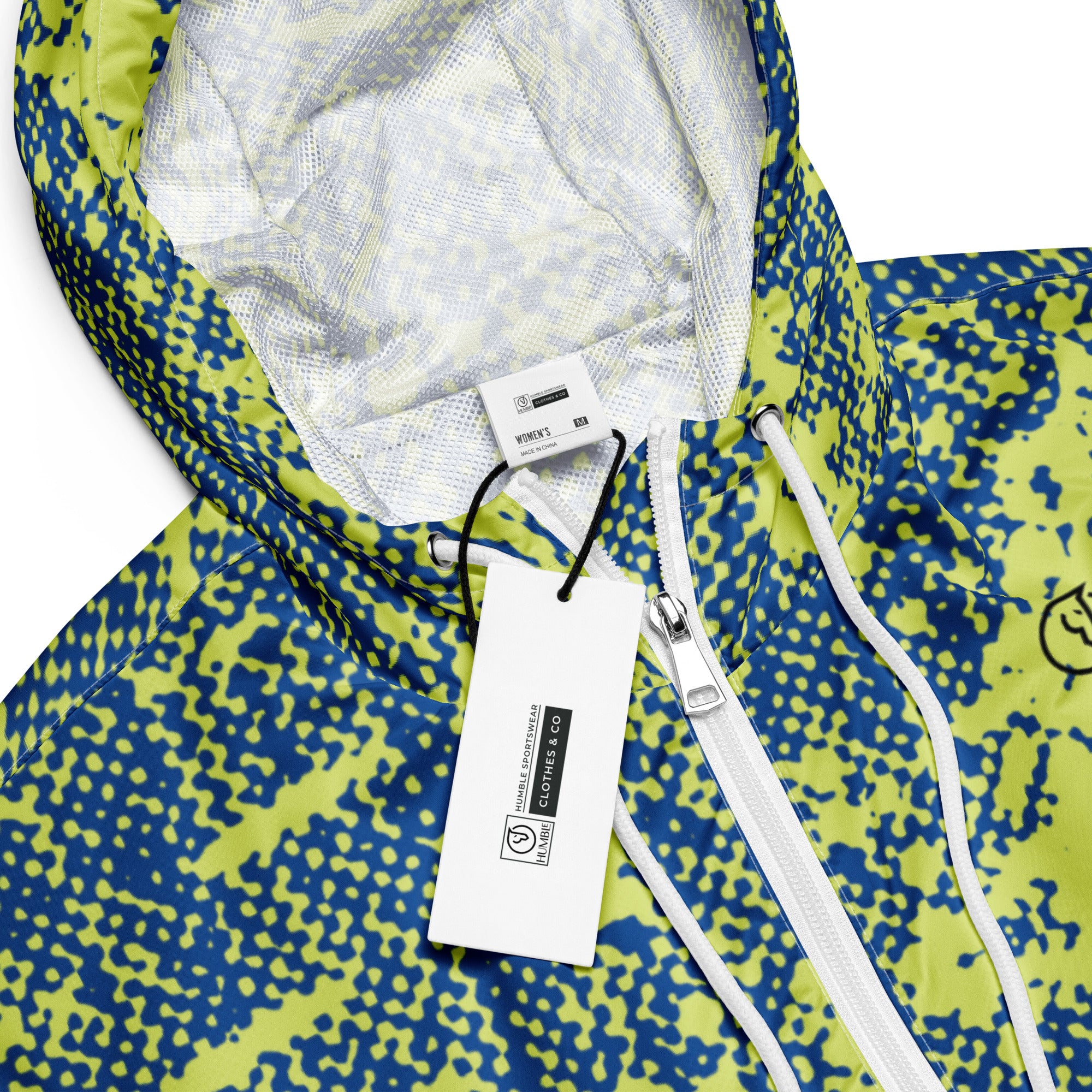 Close-up of a windbreaker hoodie jacket with a patterned design and label.