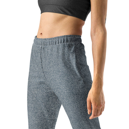 Person wearing blue patterned slim fit jogger pants on a white background