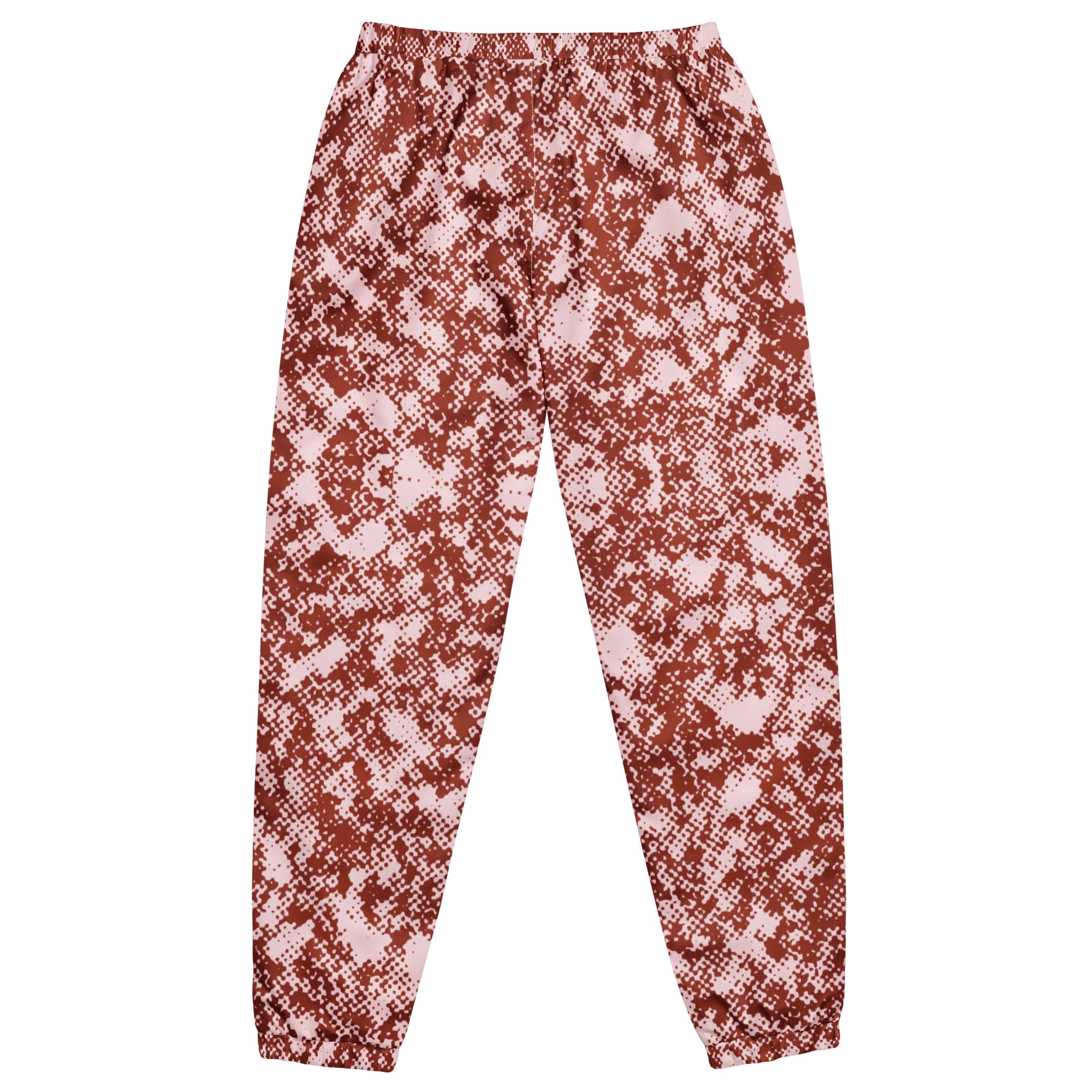 Red and white patterned track pants on a white background
