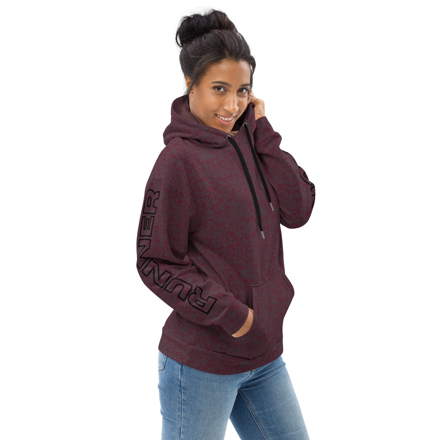 Woman wearing a maroon relaxed fit hoodie with text on the sleeve against a white background