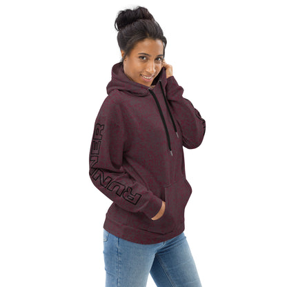 Woman wearing a maroon relaxed fit hoodie with text on the sleeve against a white background