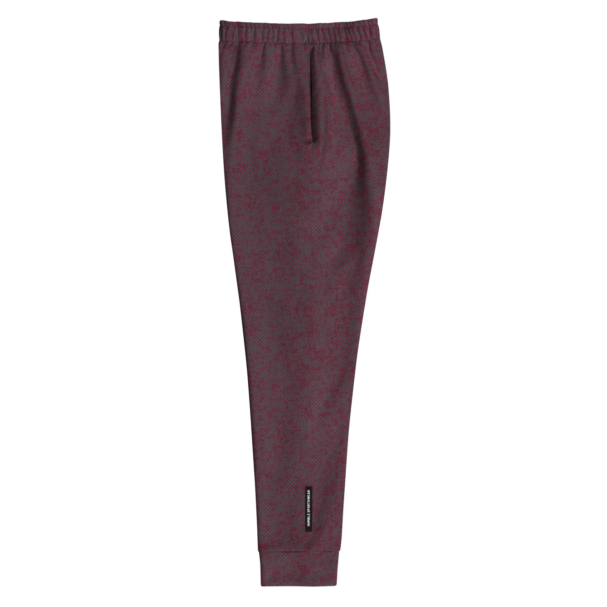 side view of maroon slim fit joggers with a small logo on a white background