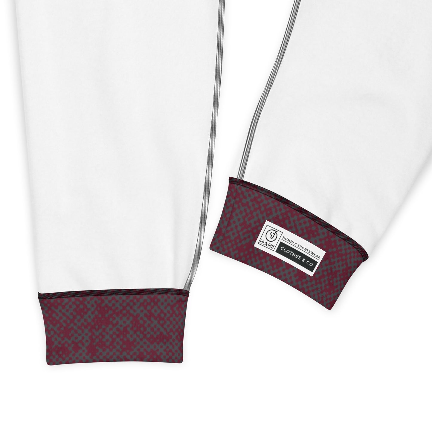 Close-up of interior slim fit jogger pants maroon fabric cuff and label on a white background