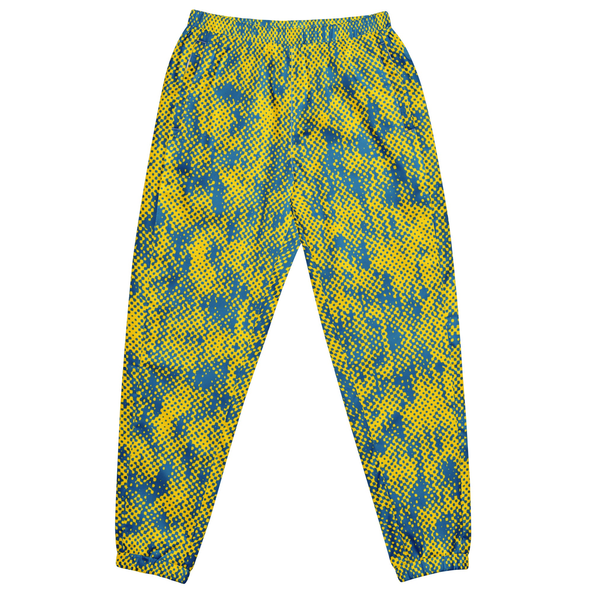 front view of yellow and blue patterned track pants on a white background